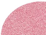 Close-up of pink round craft beads tightly packed on a curved surface.