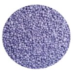 Close-up of tiny purple sugar pearls covering a surface as a candy sprinkles texture