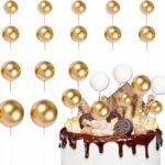 1f17d2d1e3937d5100df358f42881678-2jpg › Udanewypieki Chocolate drip cake topped with cookies and wafers, set against a backdrop of gold balloons for a festive celebration.