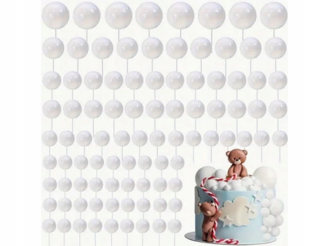 White globe string lights hang overhead above a pastel birthday cake with teddy bears on top, creating a festive backdrop, the scene soft and whimsical.