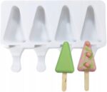 b0d3aa6f373a2fd7e1a86be7ca0c5bd8jpg › Udanewypieki White plastic popsicle mold tray with four slots and two decorated tree-shaped popsicles (green triangle and pink triangle) with drizzle icing