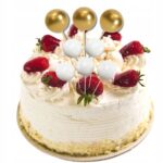 f083ad38ae9c34a77e4bb45887662494-1jpg › Udanewypieki Layer cake topped with whipped cream, fresh strawberries, and white and gold cake pops as decorations.
